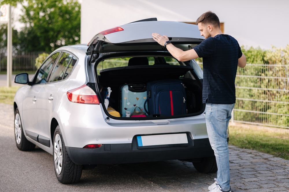 Side,View,Of,Handsome,Man,Close,Hatchback,Car,For,Trunk.